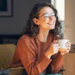Girl Smiling With Tea