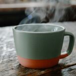 Steaming Coffee Mug On Wood Table 2.jpg